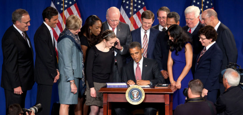 President Barack Obama signs the America Invents Act into law in 2011. The bill streamlines certain aspects of America's IP laws. Pictured at far right is Dr. Gary K. Michelson, a retired orthopedic surgeon and prolific medical inventor who championed the bill due to its potential to help new entrepreneurs, start-up companies, and inventors.