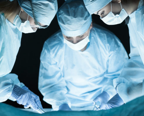 Operating room staff utilize Dr. Gary K. Michelson's new invention, Spine Essentials. Spine Essentials is a platform of spinal instruments and spinal implants for use in common neck surgeries, designed to create a better surgical experience and facilitate better patient outcomes.